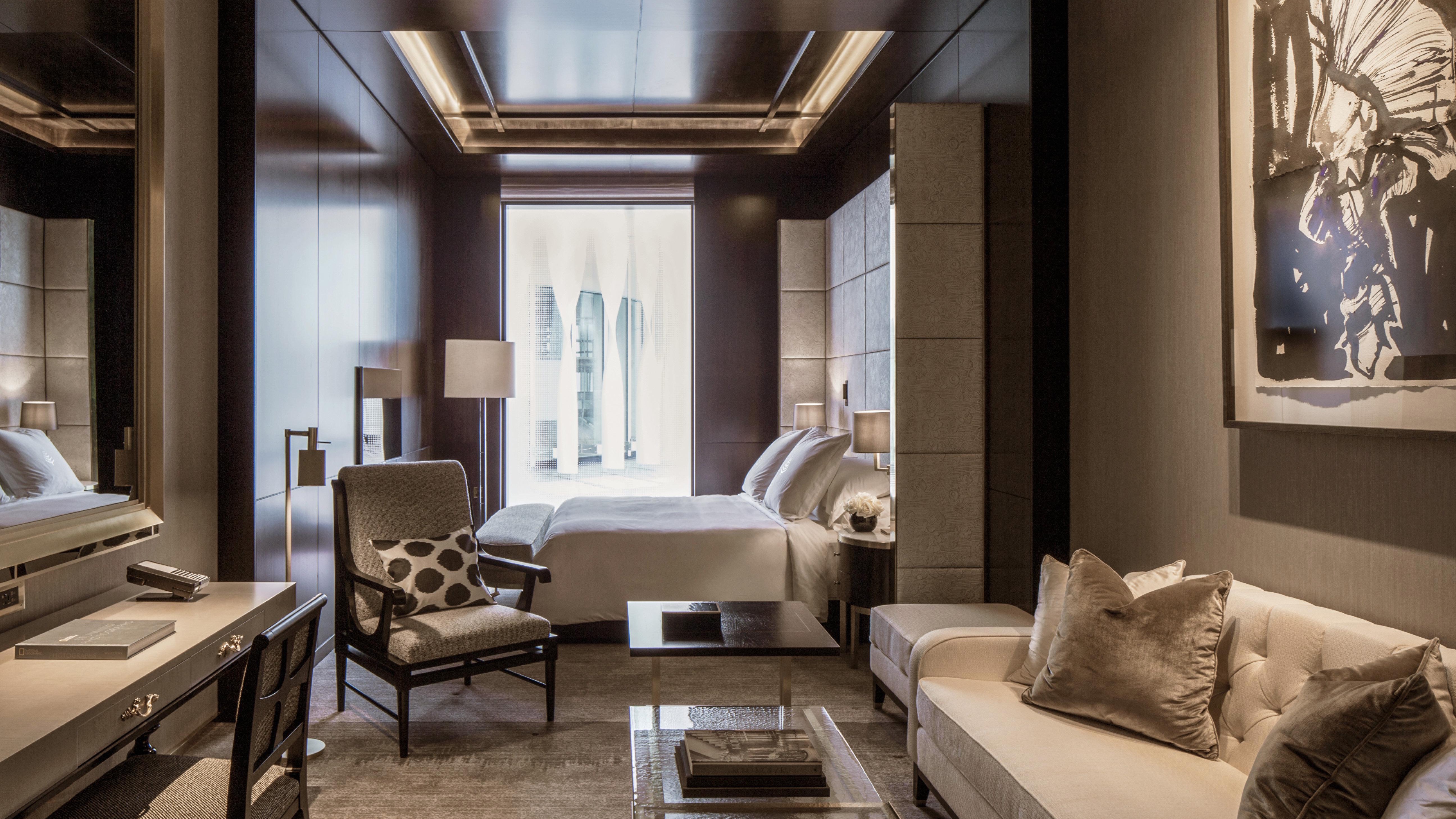 Grey, futuristic design with no colour blasts but matching grey decor, seating area and window.