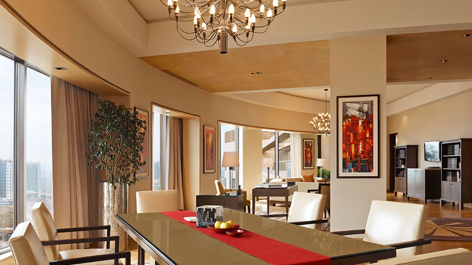 Suite with dining area, multiple windows and large living space at Trident, Bandra Kurla