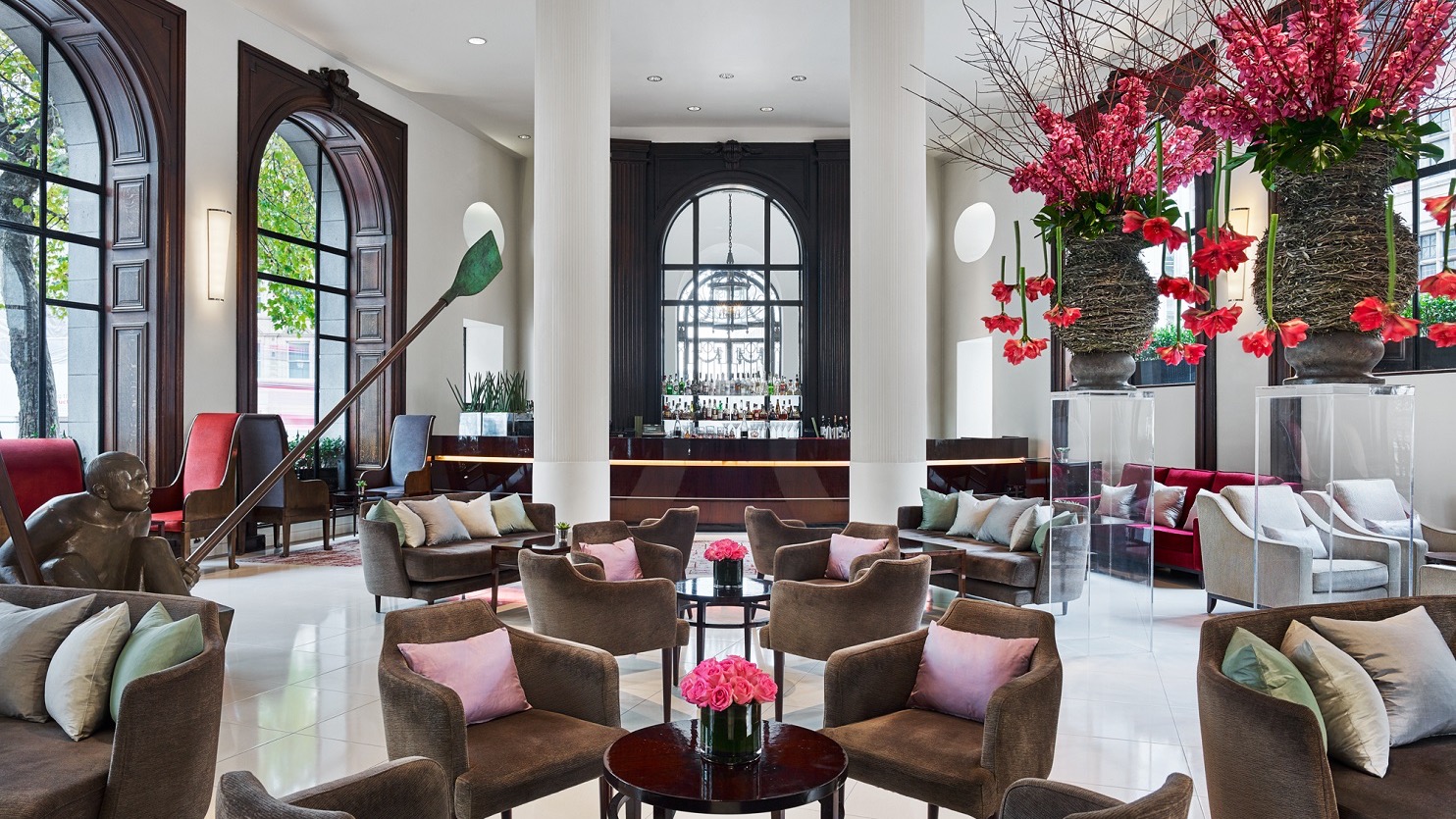 The lobby bar at one aldwych with brown chairs.