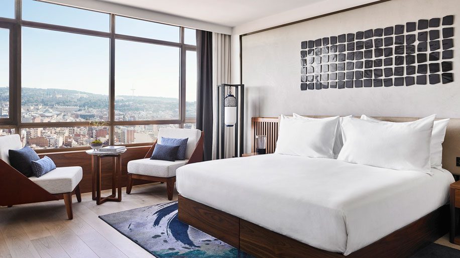 a room with a baclony overlooking the city at Nobu Hotel Barcelona