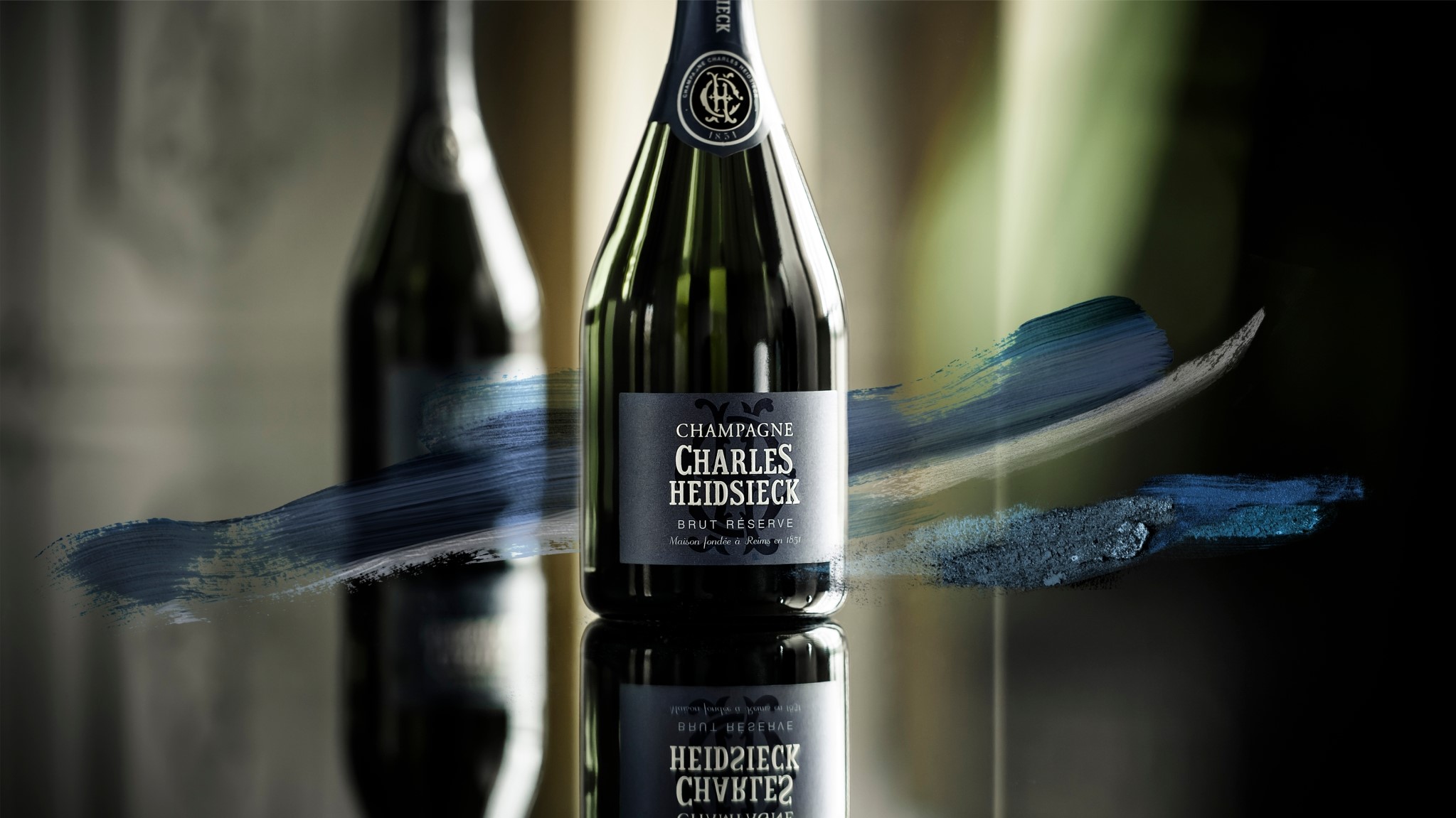 Charles Heidsieck champagne bottle on glass floor 