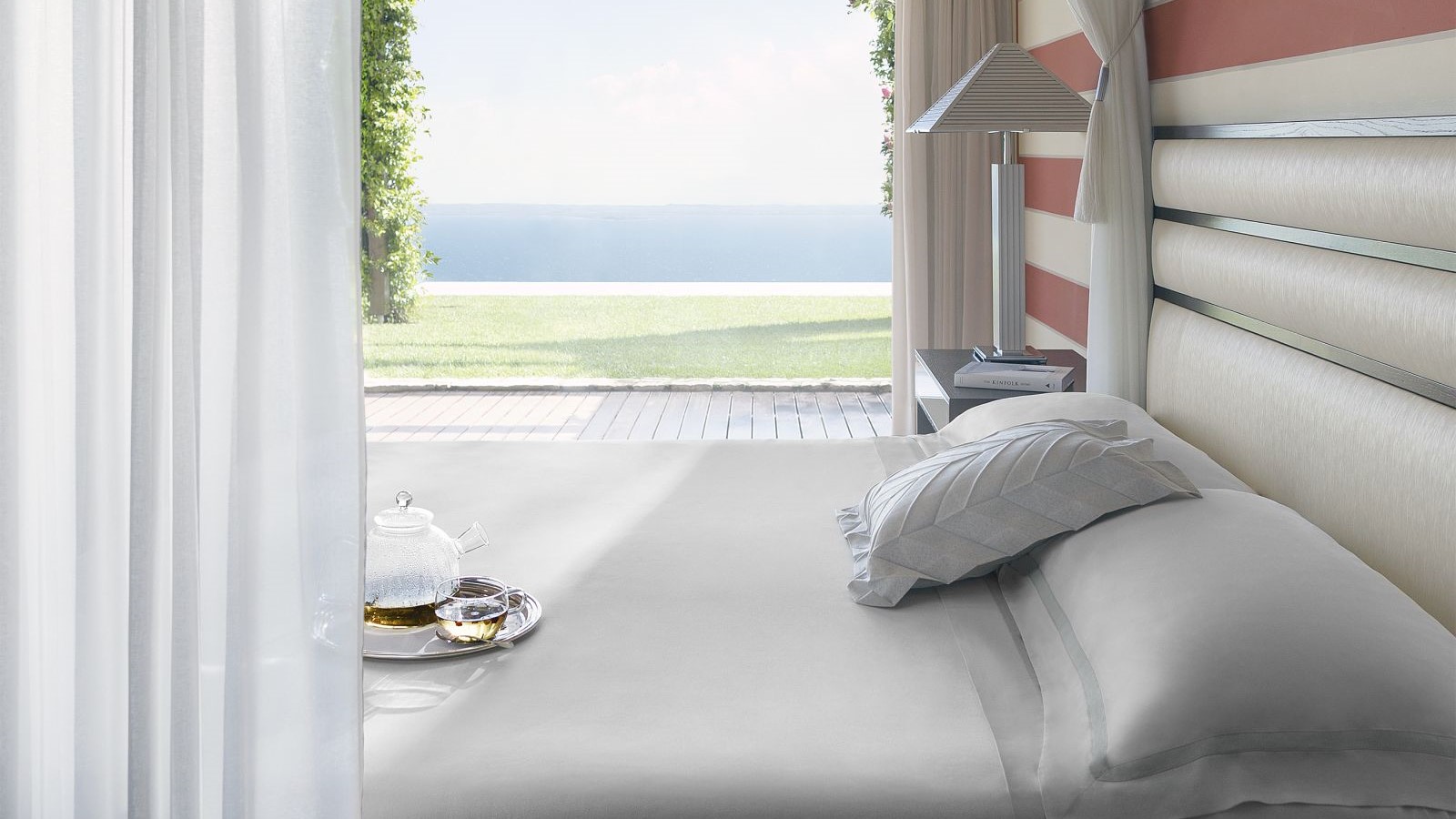 a suite's bed at the Lefay Resort & Spa Lago di Garda