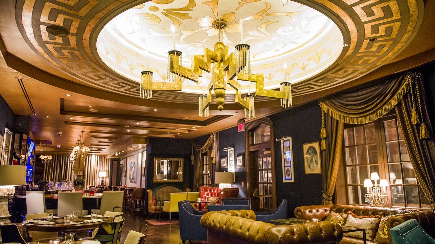 Resturant at the windsor arms hotel toronto with a brown ceiling and blue and gold decor