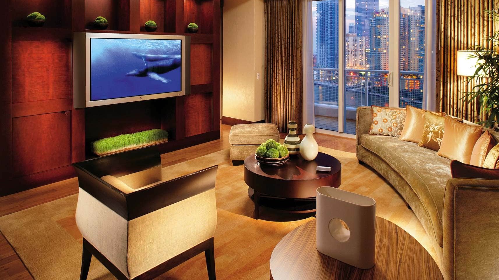 Deluxe tv-room and lounge with a private terrace offering view of Miami city at the iconic Mandarin Oriental Miami
