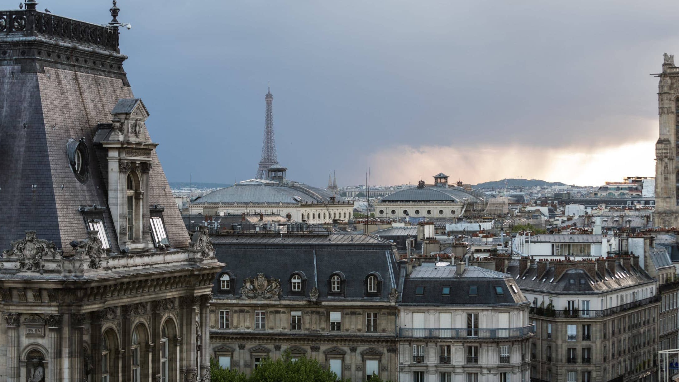 View of french architecture, the Eiffel Tower from Le Perchoir Marais. 