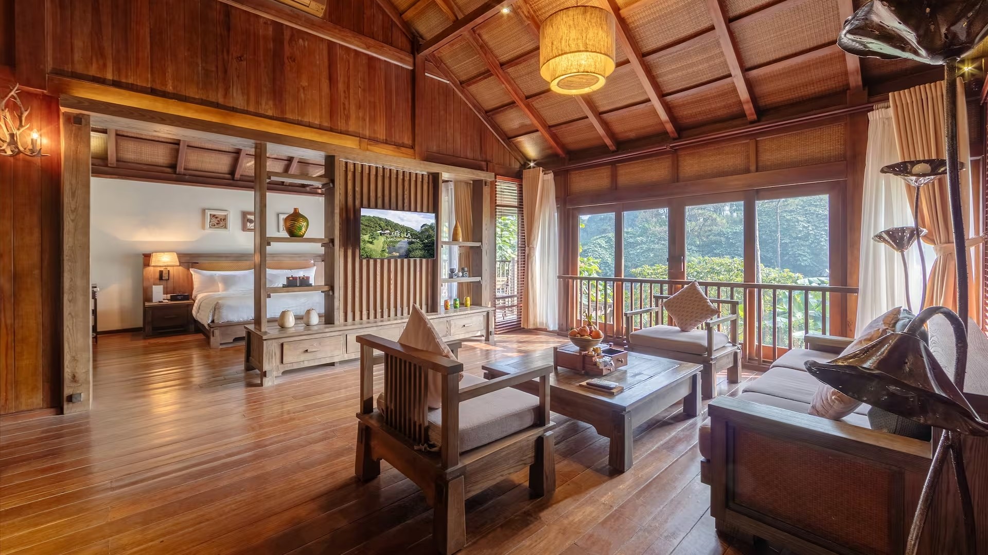 a suite at Melia Ba Vi Mountain Retreat with a view of the forest