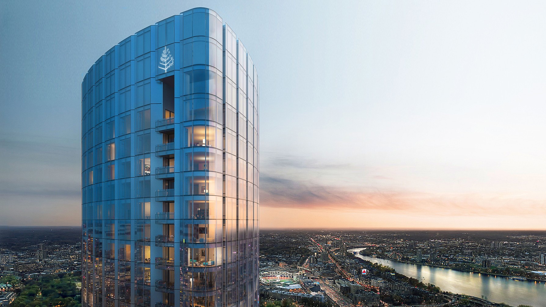 Large modern hotel made of glass with a logo on top.