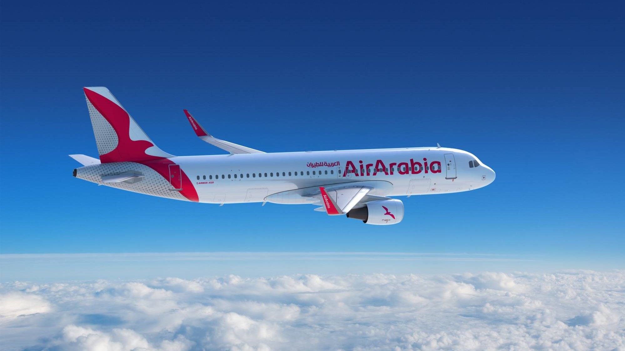 Air Arabia plane in the sky between the clouds