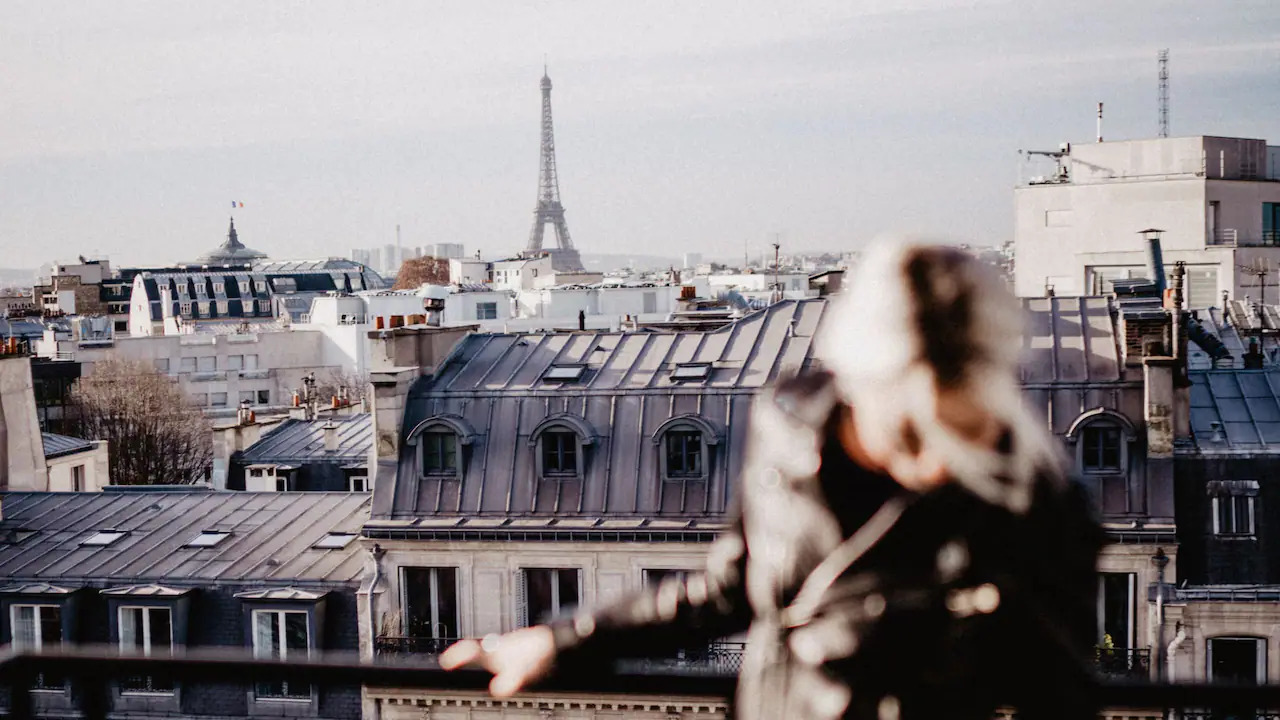 Woman standing on a terrace at hyatt paris madeleine